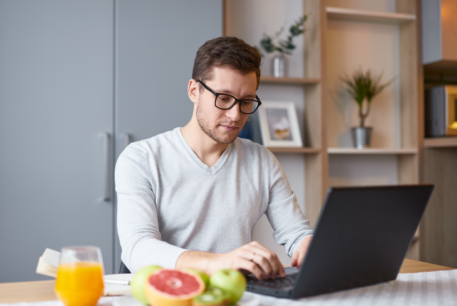 Man using laptop at home